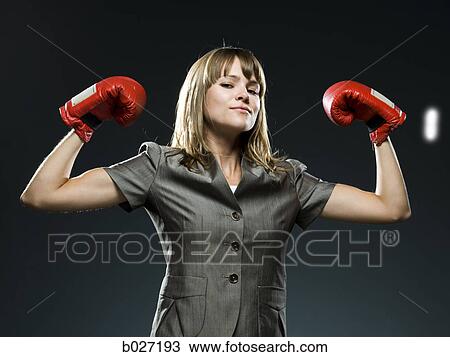 businesswoman wearing boxing gloves View Large Photo Image Stock Image - businesswoman wearing boxing gloves. Fotosearch