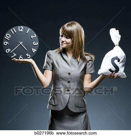 businesswoman weighing time versus money View Large Photo Image Stock Image - businesswoman weighing time versus money. Fotosearch