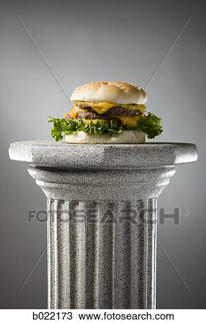 cheeseburger on a pedestal View Large Photo Image Stock Image - cheeseburger on a pedestal. Fotosearch