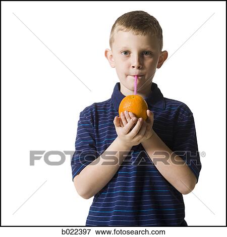 child drinking an orange with a straw in it View Large Photo Image Stock Photo - child drinking an orange with a straw in it. Fotosearch