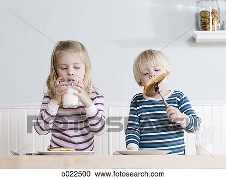 children eating breakfast View Large Photo Image Stock Image - children eating breakfast. Fotosearch
