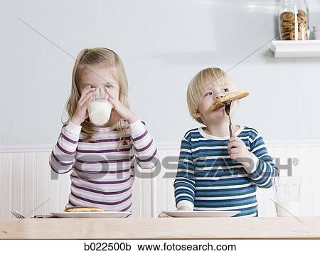 children eating breakfast View Large Photo Image Stock Image - children eating breakfast. Fotosearch