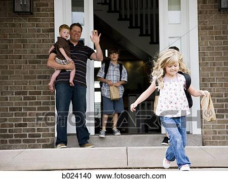 Stock Image - children leaving for school as father watches. Fotosearch