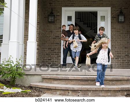 children leaving for school as father watches View Large Photo Image Stock Image - children leaving for school as father watches. Fotosearch