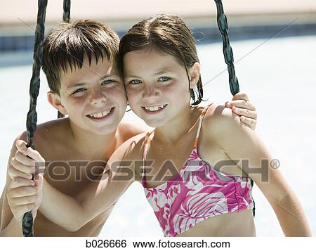 children on a tire swing at a waterpark View Large Photo Image Stock Photograph - children on a tire swing at a waterpark. Fotosearch