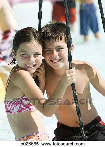 children on a tire swing at a waterpark View Large Photo Image Stock Photography - children on a tire swing at a waterpark. Fotosearch