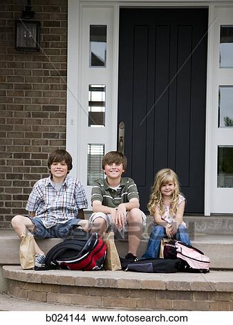 children sitting on the front step of their house View Large Photo Image Picture - children sitting on the front step of their house. Fotosearch