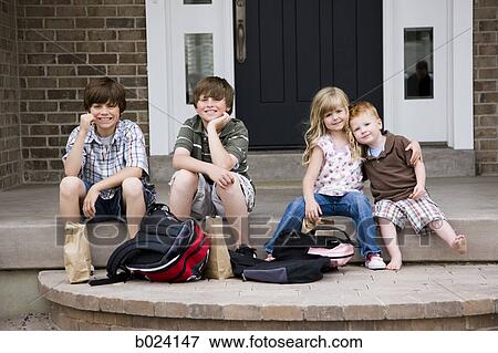 children sitting on the front step of their house View Large Photo Image Stock Photo - children sitting on the front step of their house. Fotosearch