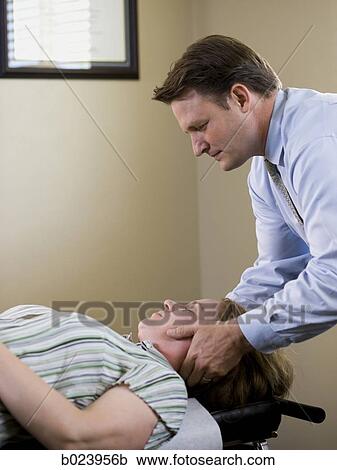 chiropractor treating a patient View Large Photo Image Stock Image - chiropractor treating a patient. Fotosearch