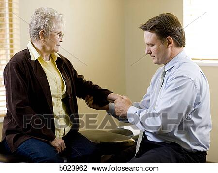 chiropractor treating a patient View Large Photo Image Stock Image - chiropractor treating a patient. Fotosearch