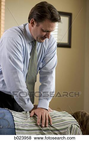 chiropractor treating a patient View Large Photo Image Stock Photo - chiropractor treating a patient. Fotosearch
