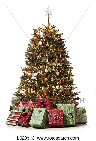 Stock Image - christmas tree with presents underneath it. Fotosearch