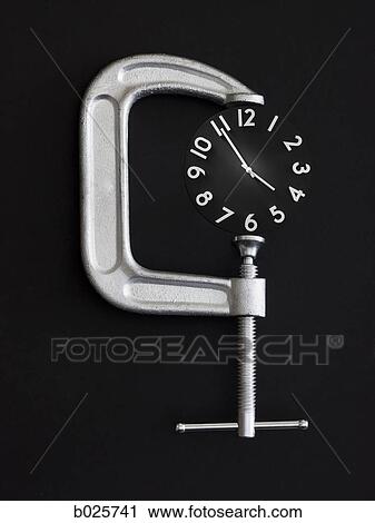 clock in a clamp View Large Photo Image Stock Image - clock in a clamp. Fotosearch