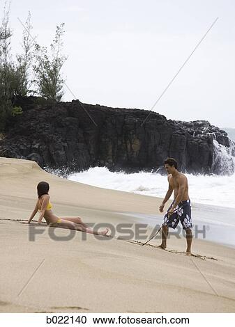 couple at the beach View Large Photo Image Stock Image - couple at the beach. Fotosearch