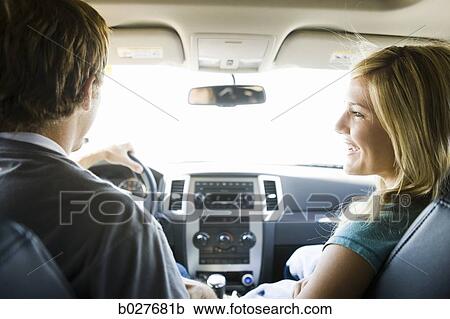 couple driving in the car and laughing View Large Photo Image Stock Image - couple driving in the car and laughing. Fotosearch