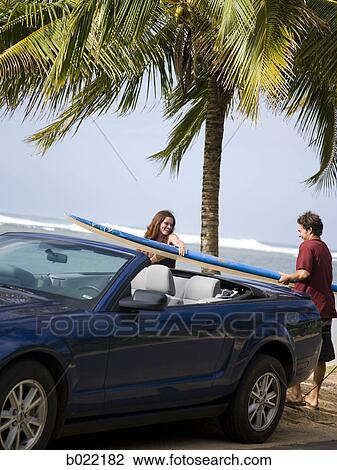 couple going to the beach to surf View Large Photo Image Stock Image - couple going to the beach to surf. Fotosearch