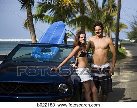 couple going to the beach to surf View Large Photo Image Stock Photo - couple going to the beach to surf. Fotosearch