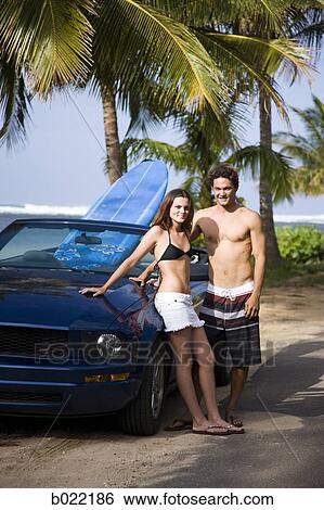 couple going to the beach to surf View Large Photo Image Stock Photograph - couple going to the beach to surf. Fotosearch