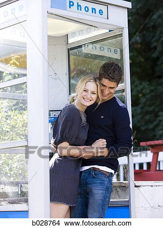 couple in a phone booth View Large Photo Image Picture - couple in a phone booth. Fotosearch