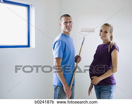 couple painting a room View Large Photo Image Stock Image - couple painting a room. Fotosearch