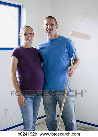 couple painting a room View Large Photo Image Stock Image - couple painting a room. Fotosearch