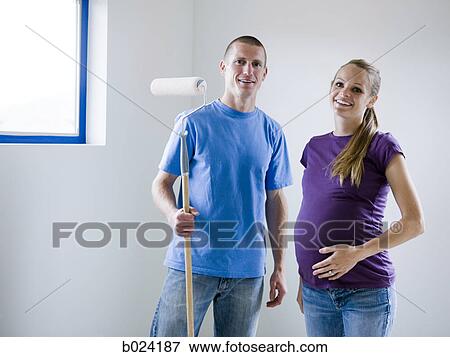 couple painting a room View Large Photo Image Stock Photo - couple painting a room. Fotosearch