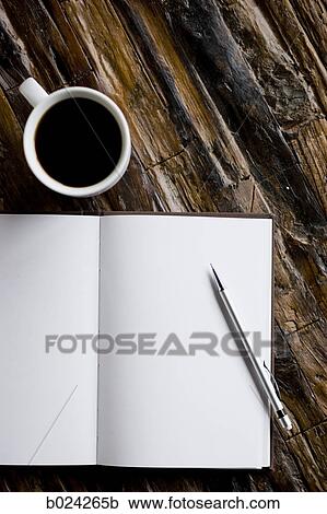 cup of coffee and a journal and pen View Large Photo Image Stock Image - cup of coffee and a journal and pen. Fotosearch