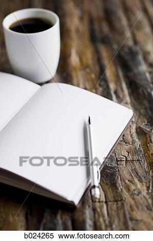 cup of coffee and a journal and pen View Large Photo Image Stock Photography - cup of coffee and a journal and pen. Fotosearch