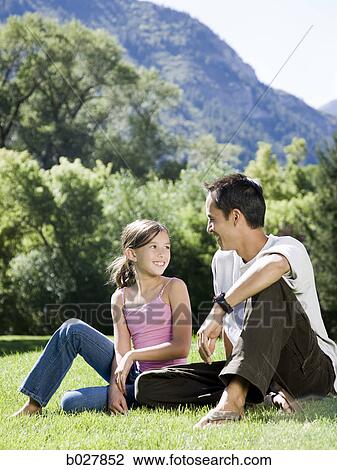 dad in the park with his daughter View Large Photo Image Stock Image - dad in the park with his daughter. Fotosearch