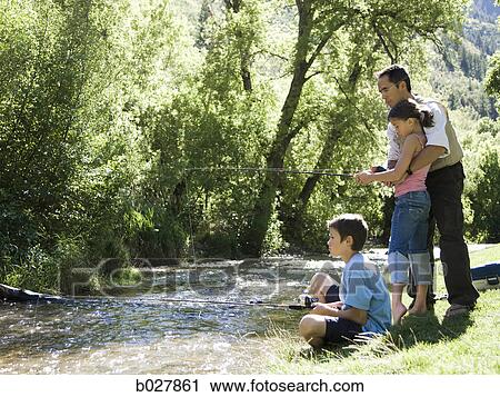 dad teaching his children to fish View Large Photo Image Stock Image - dad teaching his children to fish. Fotosearch