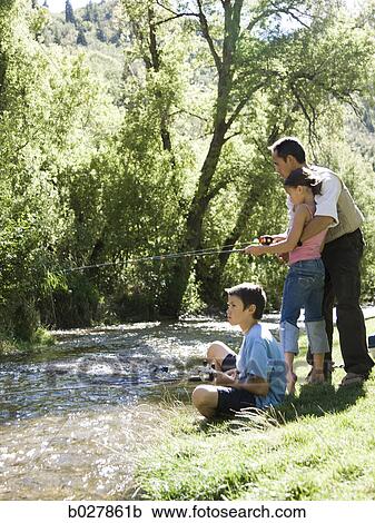 Stock Image - dad teaching his children to fish. Fotosearch