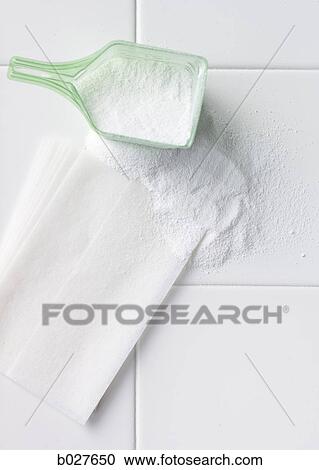 detergent and a dryer sheet on a white tile surface View Large Photo Image Stock Image - detergent and a dryer sheet on a white tile surface. Fotosearch