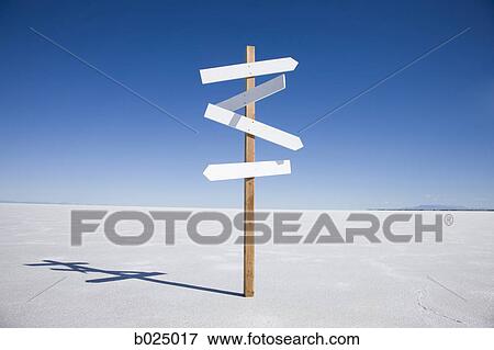 Stock Photo - direction sign in the middle of nowhere. Fotosearch