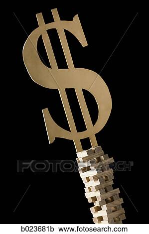 dollar symbol perched on a tower of blocks View Large Photo Image Stock Image - dollar symbol perched on a tower of blocks. Fotosearch