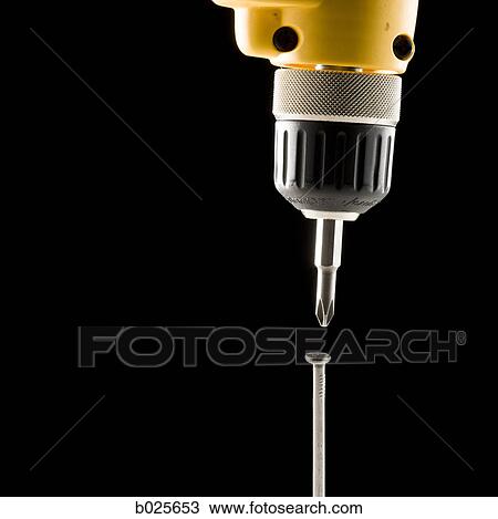 electric drill screwing a nail View Large Photo Image Stock Image - electric drill screwing a nail. Fotosearch