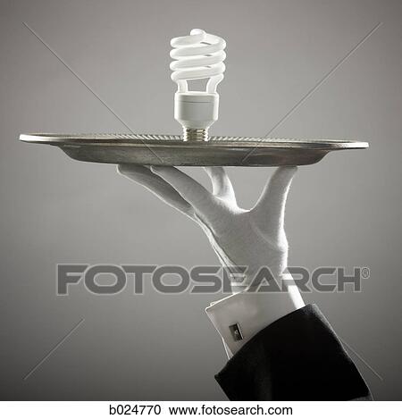 energy saving lightbulb on a platter View Large Photo Image Stock Image - energy saving lightbulb on a platter. Fotosearch