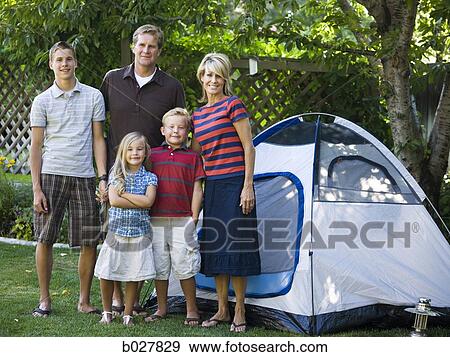 family in the backyard with a tent View Large Photo Image Stock Photo - family in the backyard with a tent. Fotosearch