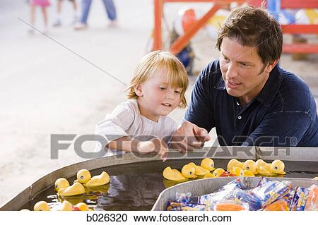 father and son at a carnival View Large Photo Image Stock Image - father and son at a carnival. Fotosearch