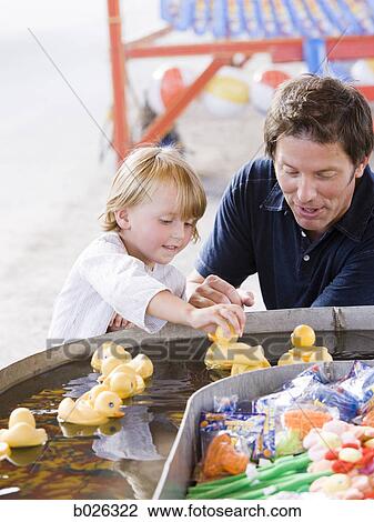 father and son at a carnival View Large Photo Image Stock Image - father and son at a carnival. Fotosearch