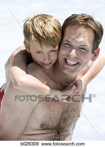 Stock Photo - father and son at a carnival. Fotosearch