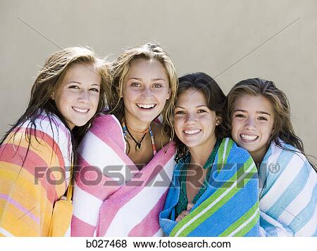 Stock Photo - four teenage girls wrapped in towels. Fotosearch