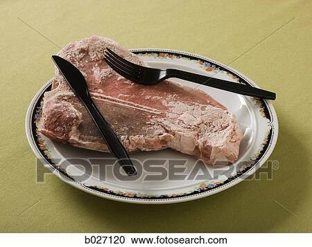 frozen uncooked steak being served on a plate View Large Photo Image Stock Image - frozen uncooked steak being served on a plate. Fotosearch