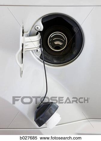 gas cap hanging from the gas tank opening View Large Photo Image Stock Photography - gas cap hanging from the gas tank opening. Fotosearch
