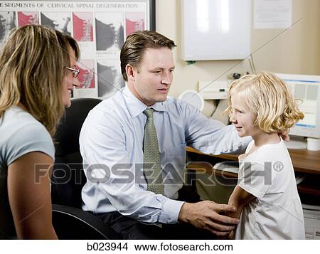 girl and her mother at chiropractor's office View Large Photo Image Picture - girl and her mother at chiropractor's office. Fotosearch