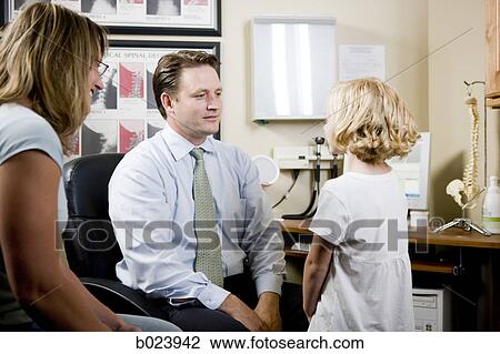Stock Image - girl and her mother at chiropractor's office. Fotosearch