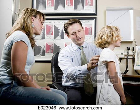Stock Photograph - girl and her mother at chiropractor's office. Fotosearch