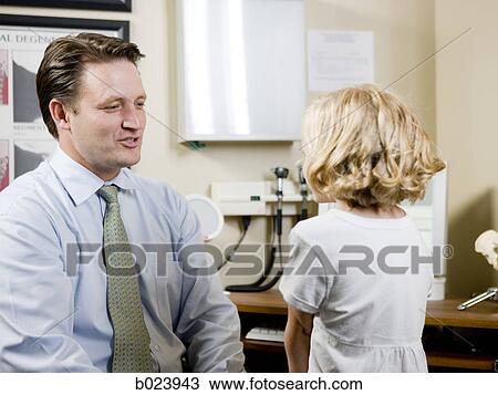 Stock Image - girl at chiropractor's office. Fotosearch