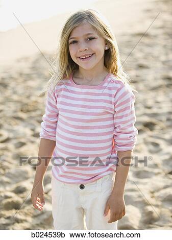Stock Image - girl at the beach. Fotosearch