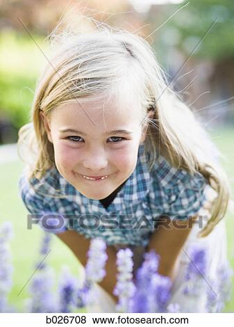 girl behind patch of flowers View Large Photo Image Stock Photo - girl behind patch of flowers. Fotosearch