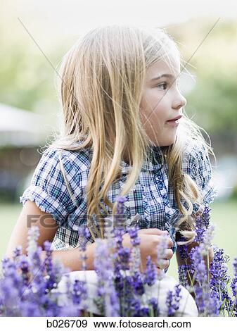 girl behind patch of flowers View Large Photo Image Stock Photo - girl behind patch of flowers. Fotosearch